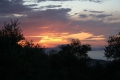 Zonsondergang vanuit Villa Nessos